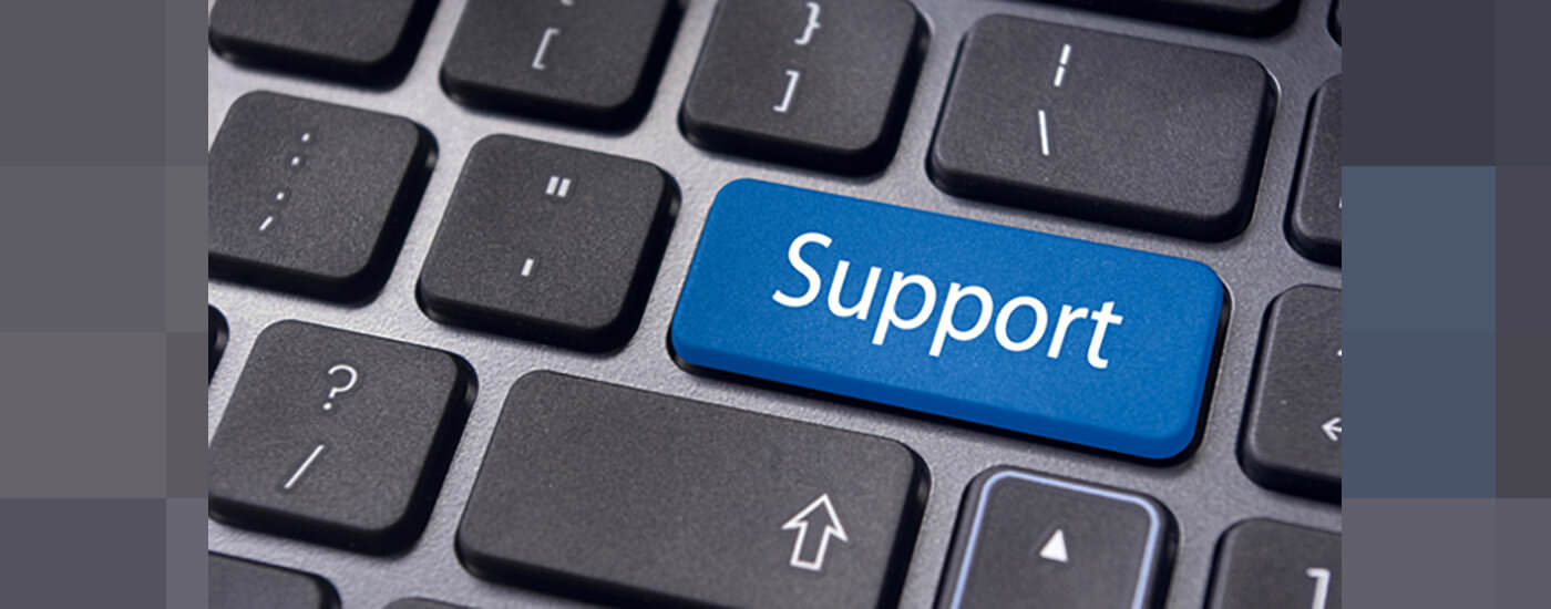 A keyboard with the return key replaced by the words support