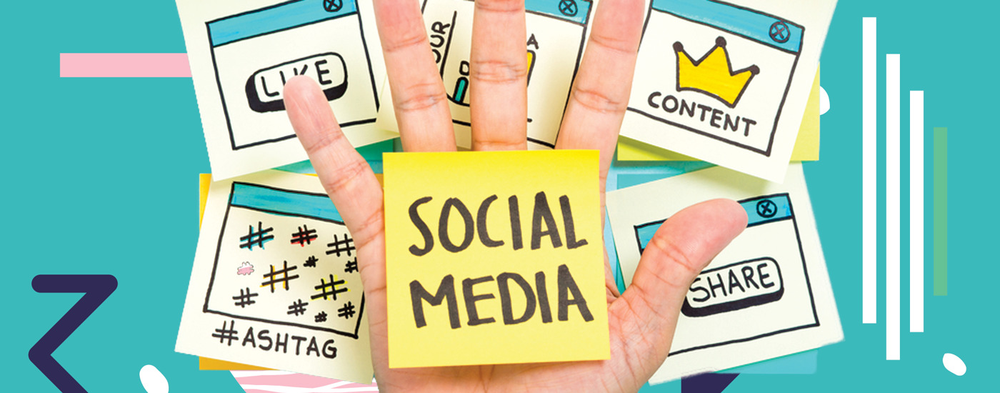 a hadn holding up a sticky that reads social media